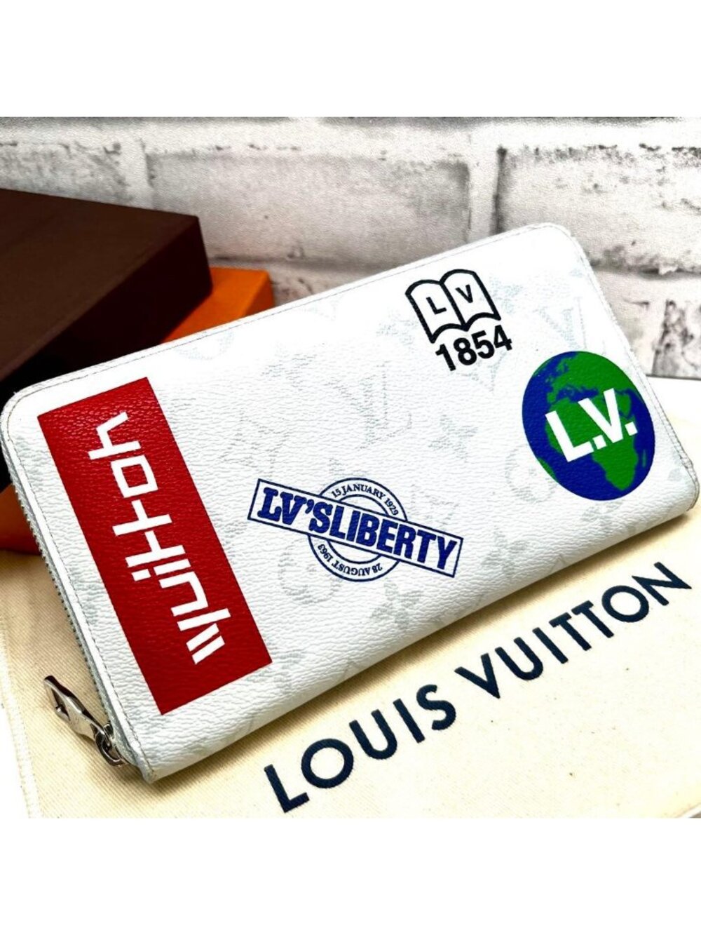 Louis Vuitton Logo Story Zippy Organizer Wallet